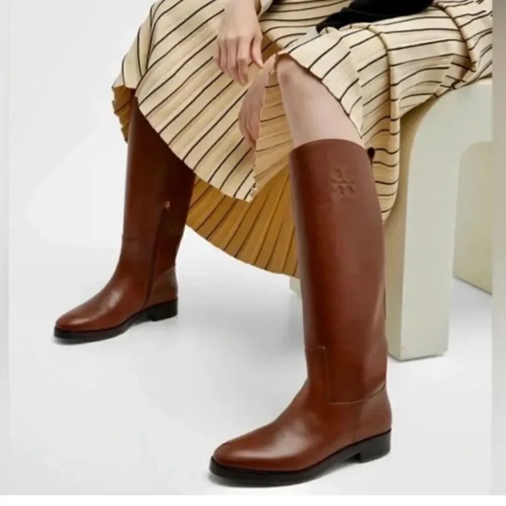 Tory Burch soft leather tall riding boots with logo stitch accent at collar